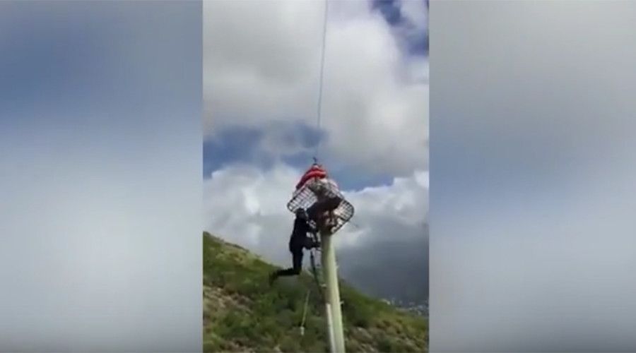 Firefighter plunges 30 feet as helicopter rescue effort strikes electricity pole (VIDEO)