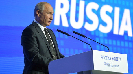 Russian President Vladimir Putin addresses the plenary session 
