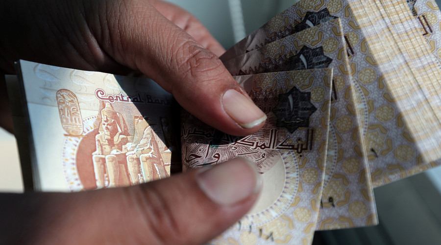 Egypt devalues currency to spur economy and meet IMF loan demand