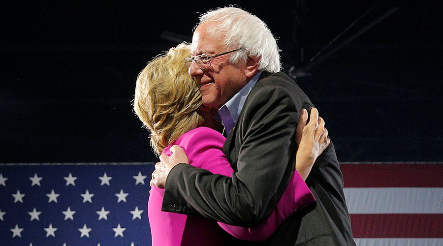 U.S. Democratic presidential nominee Hillary Clinton is hugged by U.S. Senator Bernie Sanders © Brian Snyder