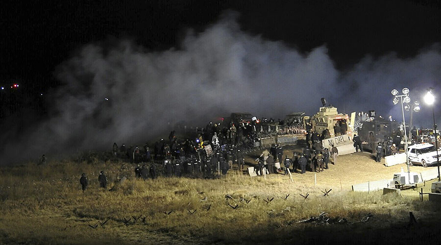 Law enforcement officers surround demonstrators protesting against plans to pass the Dakota Access pipeline during a standoff at the Backwater Bridge in Morton County, North Dakota, U.S., November 20, 2016. © Morton County Sheriff's Department / Handout via Reuters