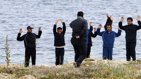 Police stop the refugees, southern Italian island of Lampedusa. File photo. © Antonio Parrinello