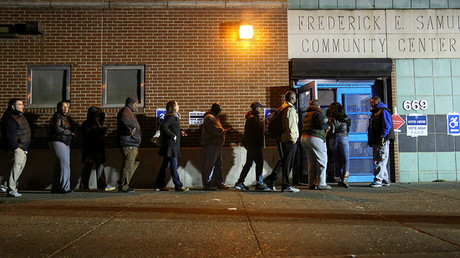 Voters line up to cast their ballot on election day at a polling station in Harlem, New York, U.S., November 8, 2016 © Bria Webb
