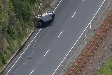 This aerial photo taken and received on November 14, 2016 shows a car on its side near Kaikoura following an earthquake on the South Island's east coast. © Mark Mitchell