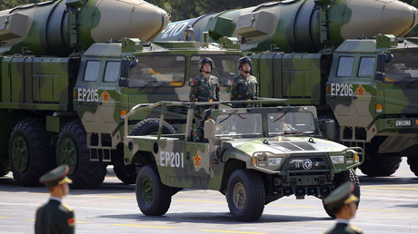 Military vehicles carrying DF-21D ballistic missiles roll to Tiananmen Square © Damir Sagolj