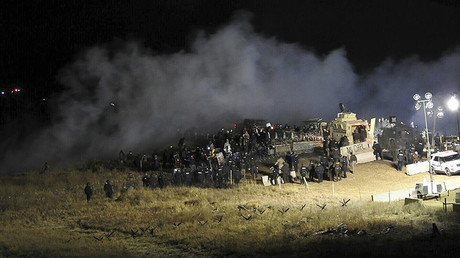 Law enforcement officers surround demonstrators protesting against plans to pass the Dakota Access pipeline during a standoff at the Backwater Bridge in Morton County, North Dakota, U.S., November 20, 2016. © Morton County Sheriff's Department / Handout via Reuters