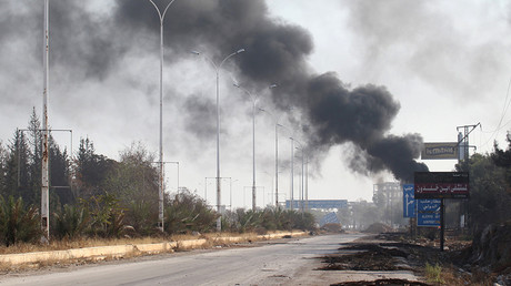 FILE PHOTO: Smoke rises near a damaged road in Dahiyet al-Assad, west Aleppo city, Syria October 30, 2016 © Ammar Abdullah