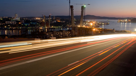Long exposure picture shows car light trails on the bridge across the Golden Horn bay in Russia's Far Eastern city of Vladivostok © Yuri Maltsev 