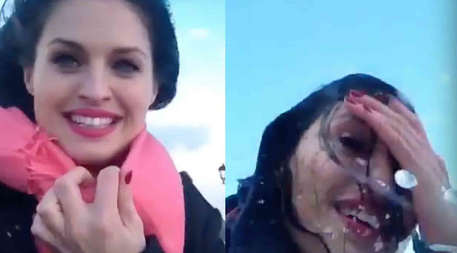 Wave almost sweeps woman out to sea as she films storm in Sochi (VIDEO)
