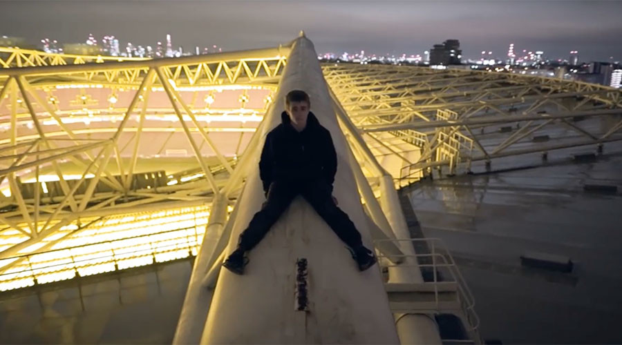 Heart-stopping video shows fearless daredevils scale stadium roof without harness
