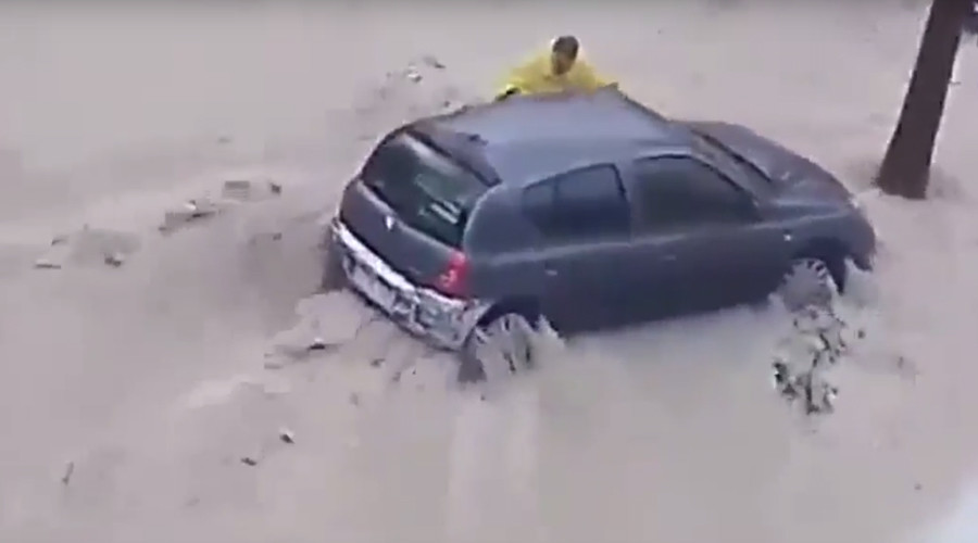Man swept to his death in violent flood as Spain battles fierce storms (VIDEO)