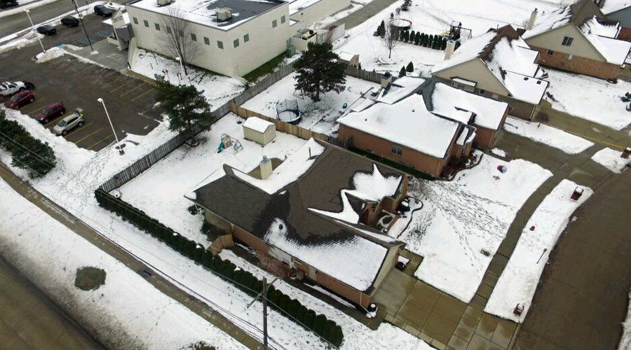 Sinkhole swallows Detroit suburb, dozens evacuated
