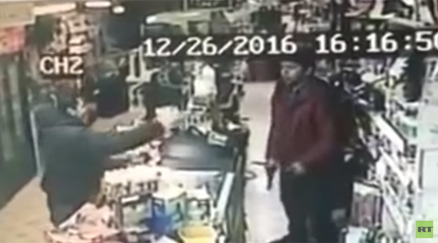 Teenage shop clerk fearlessly snatches gun from armed robber (VIDEO)