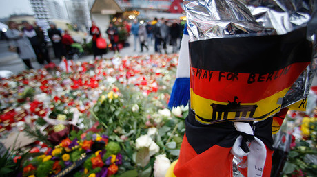 Flowers and candles are placed near the Christmas market at Breitscheid square in Berlin, Germany, December 23, 2016 © Hannibal Hanschke