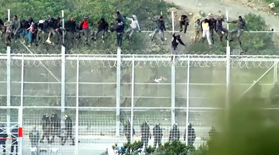 ‘Extremely violent, organized:’ 1,000 migrants storm Spanish enclave bordering Morocco (VIDEO)