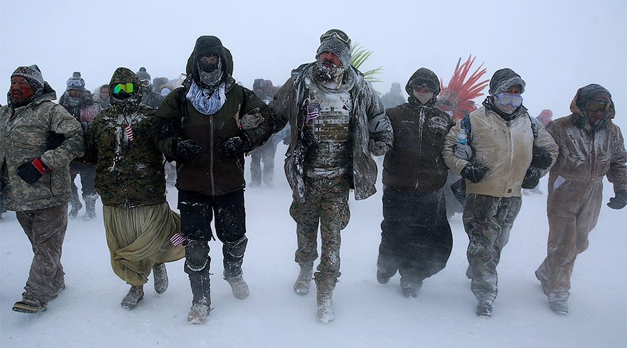 North Dakota seeks to outlaw masked rallies, allow driving over protesters