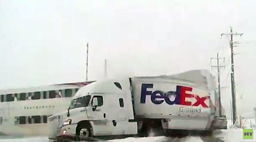 Passenger train smashes through FedEx truck at railway crossing (VIDEO)