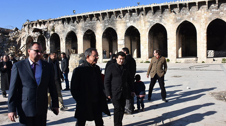 French Les Republicains (LR - The Republicans) party MPs Thierry Mariani (C-L) and Nicolas Dhuicq (C-R) visit the ancient Umayyad mosque in the old city of Aleppo on January 6, 2017 © George Ourfalian