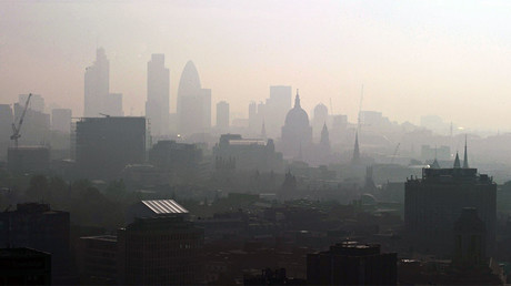 File photo: St. Paul's Cathedral is seen in the early morning sunlight among the skyline through the smog in central London. © Carl de Souza 