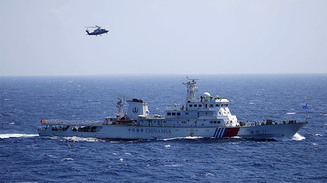 Chinese ship and helicopter in the Paracel Islands, which is known in China as Xisha Islands, South China Sea. © Stringer 
