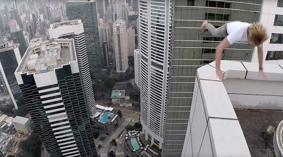 Russian rooftopper skateboards & somersaults on ledge of Hong Kong skyscraper (VIDEO)