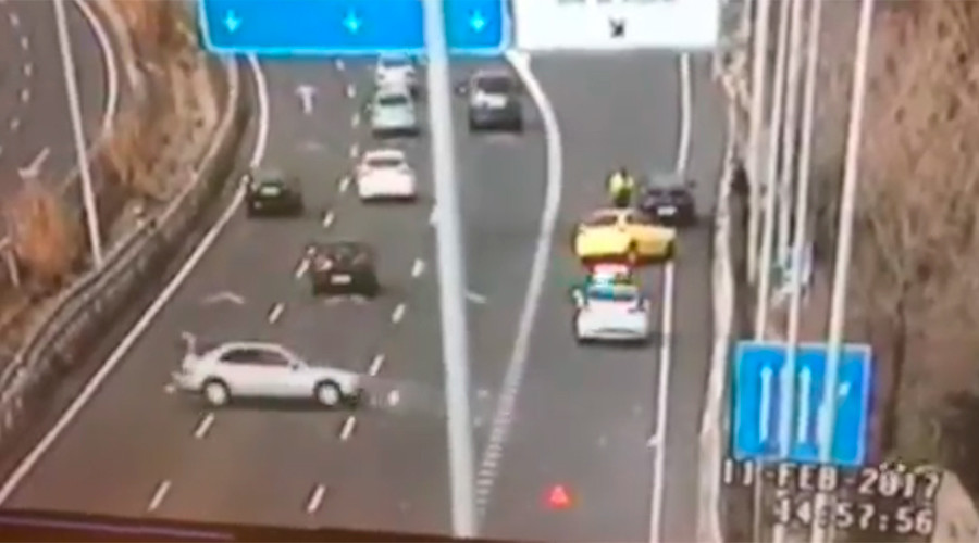 Cop cheats death in last-minute leap as car hurtles toward him (VIDEO)