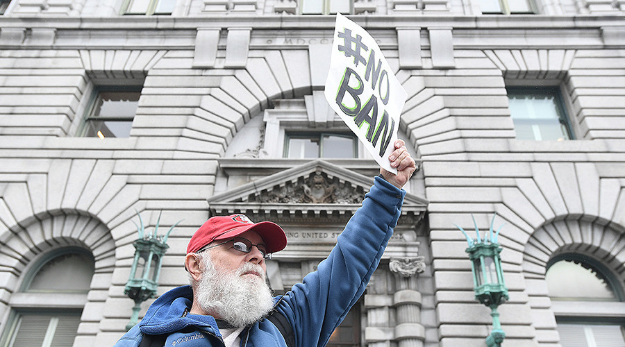 DOJ requests Seattle judge postpone further action on Trump’s travel ban