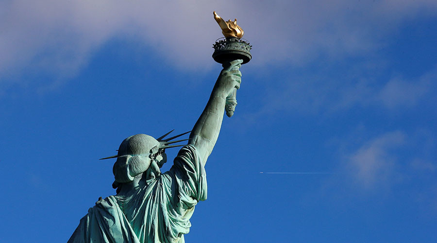 Activists hang ‘Refugees Welcome’ banner on Statue of Liberty