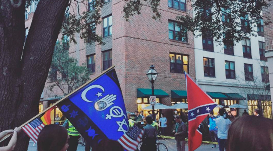 Dramatic footage shows BLM activist tear down Confederate flag on live TV & get arrested (VIDEO)