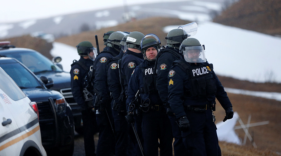 Riot police & military Humvees enter Standing Rock camp