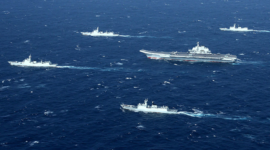 China to intercept 'intruding' aircraft, follow military vessels amid efforts to strengthen navy