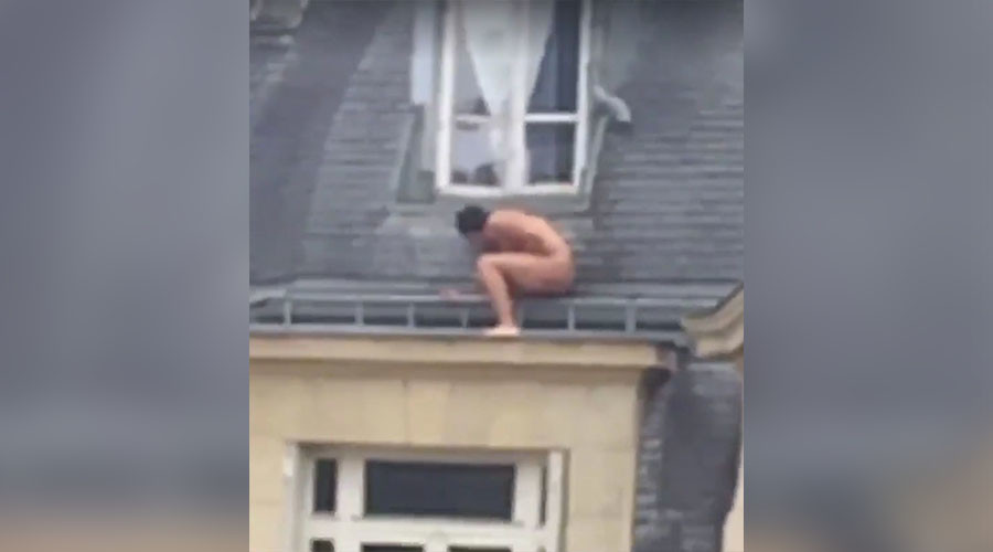 Nude man perched on apartment ledge baffles internet (VIDEO, POLL)