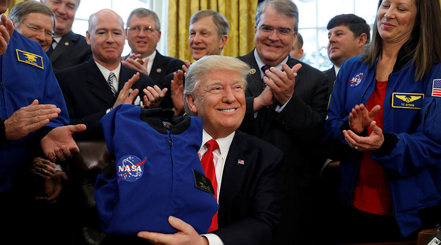 Trump signs NASA funding bill to send astronauts to Mars
