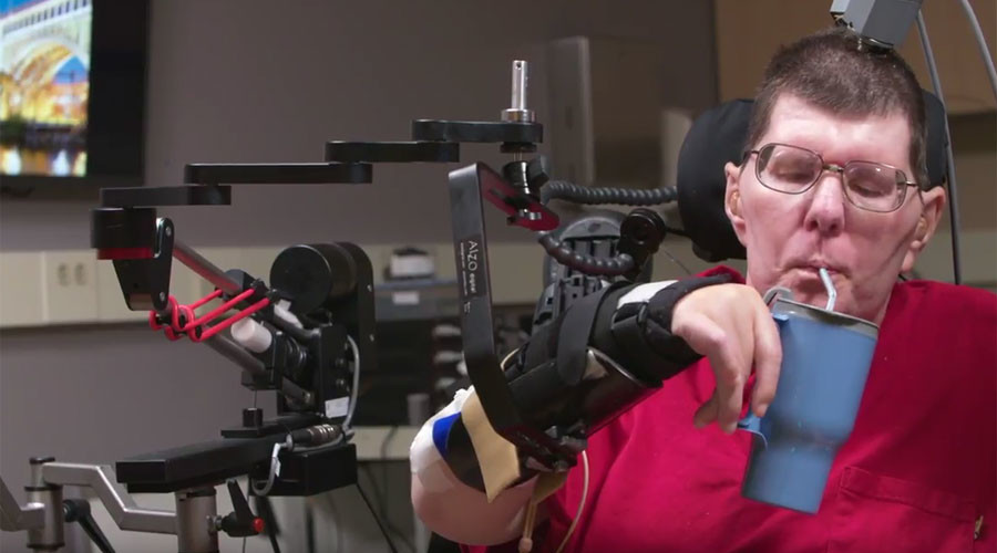 Brain power: Paralyzed man uses thoughts to move arm & hands (VIDEO)