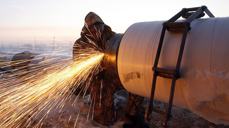 A Gazprom worker welds a part of a pipeline © Denis Sinyakov