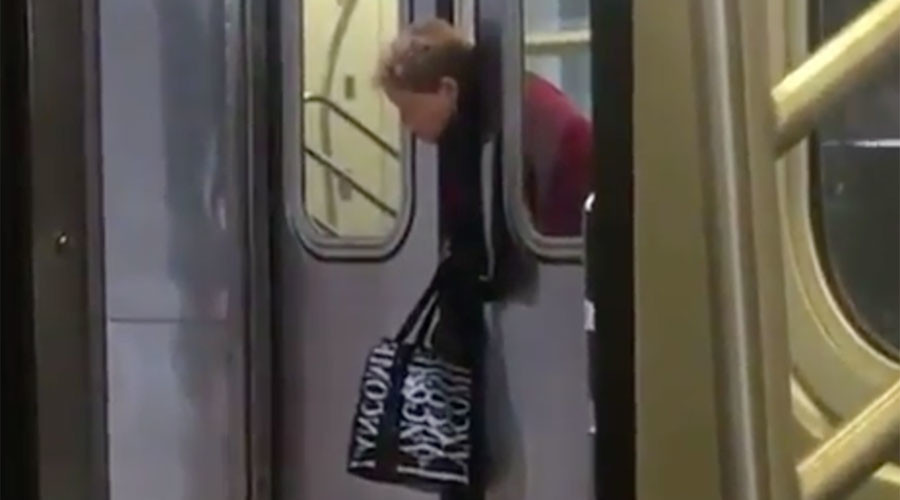 ‘New York state of mind’: Passengers filmed ignoring woman with head stuck in subway doors (VIDEO)