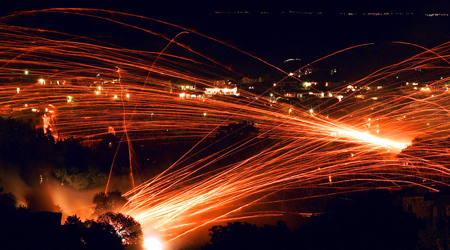 ‘Rocket War’ returns to sleepy Greek island as thousands of fireworks light up night sky (VIDEO)
