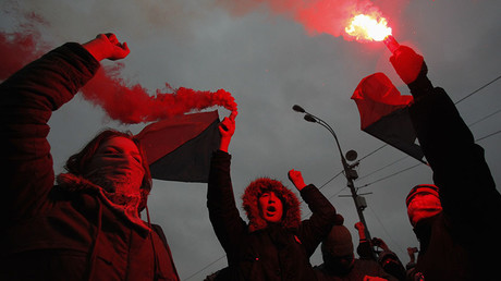 Members of a local anarchist movement burn flares during a sanctioned rally in Bolotnaya square in Moscow December 10, 2011. © Anton Golubev
