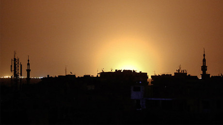 Flames rising in the distance which are believed to be coming from Damascus International Airport following an explosion early in the morning of April 27, 2017. ©
Sameer Al-Doumy / AFP