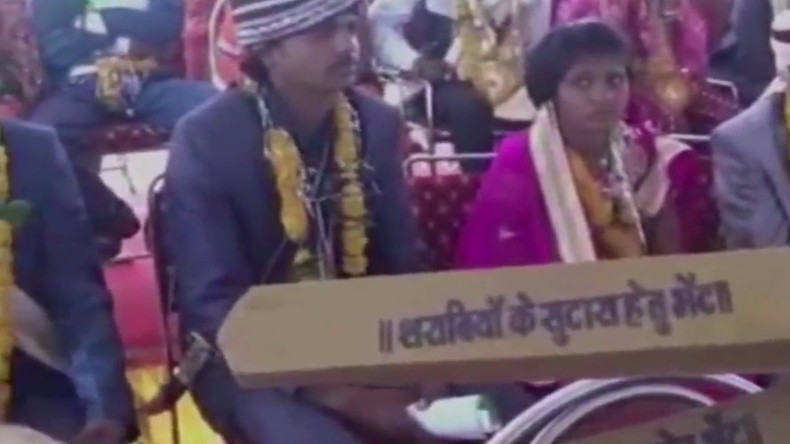 Indian minister arms 700 new brides with wooden bats against drunk ...