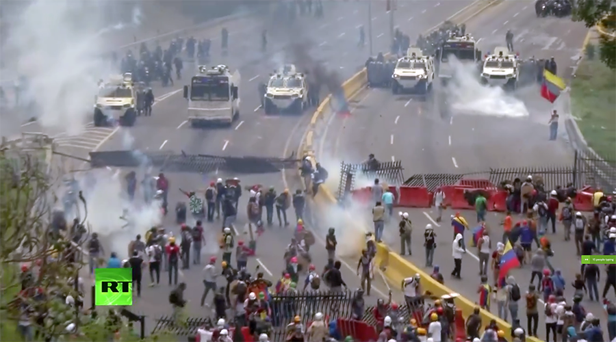Police fire water cannon at anti-govt rally in Venezuela after pelted with smoke bombs