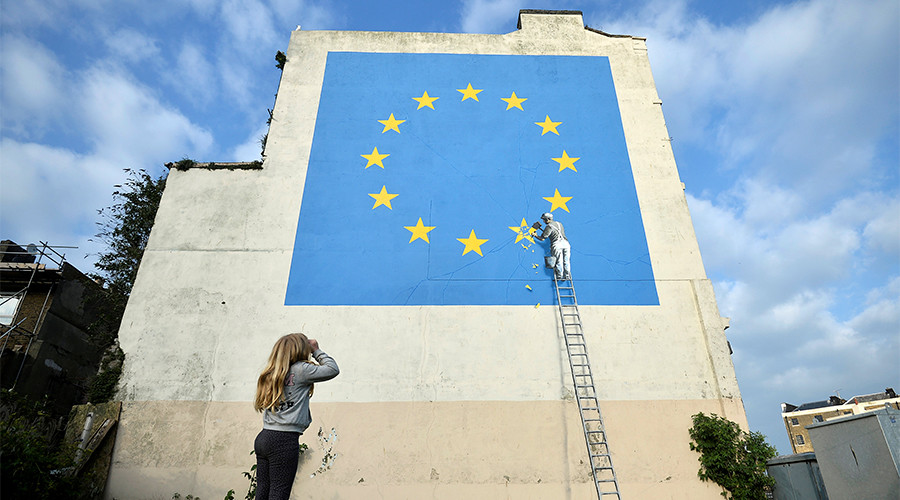 New Brexit-themed Banksy shows workman chipping away at EU flag