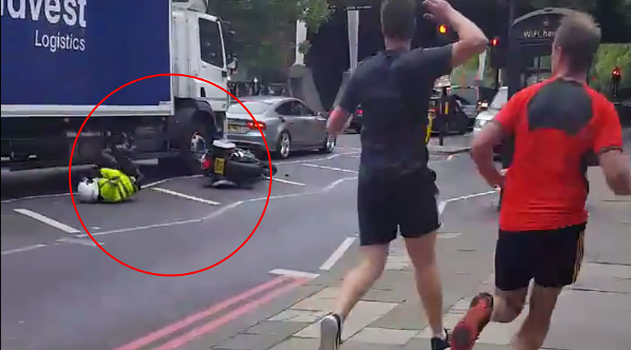 Special convoy bike cop wipes out in embarrassing London smash (VIDEO)