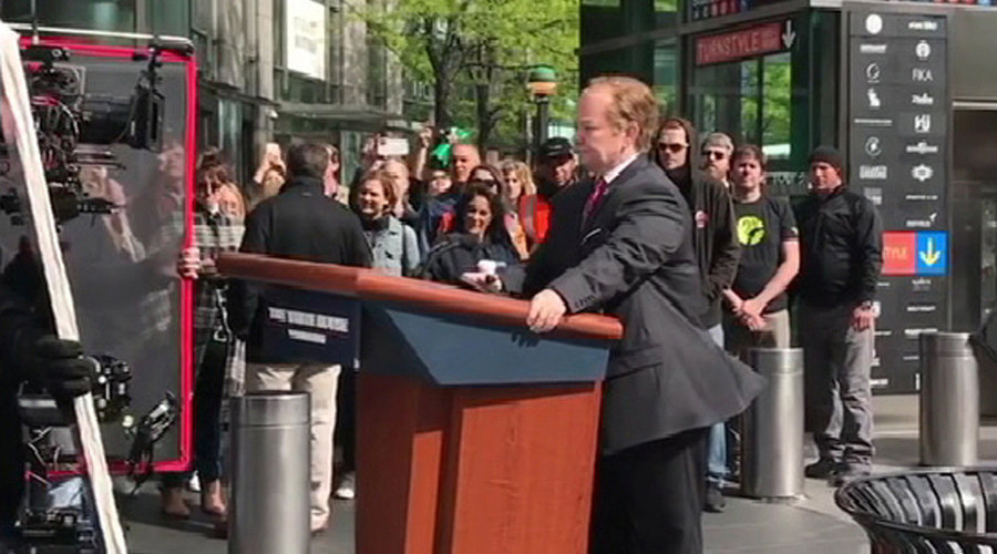 Melissa McCarthy rides Sean Spicer’s podium through New York streets