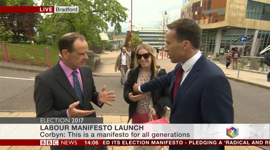 BBC reporter slapped after accidentally groping woman who interrupted live interview