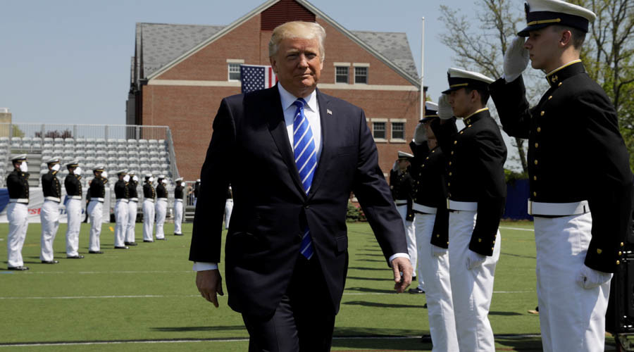 Defiant Trump fires back at ‘unfair’ media in speech to Coast Guard graduates