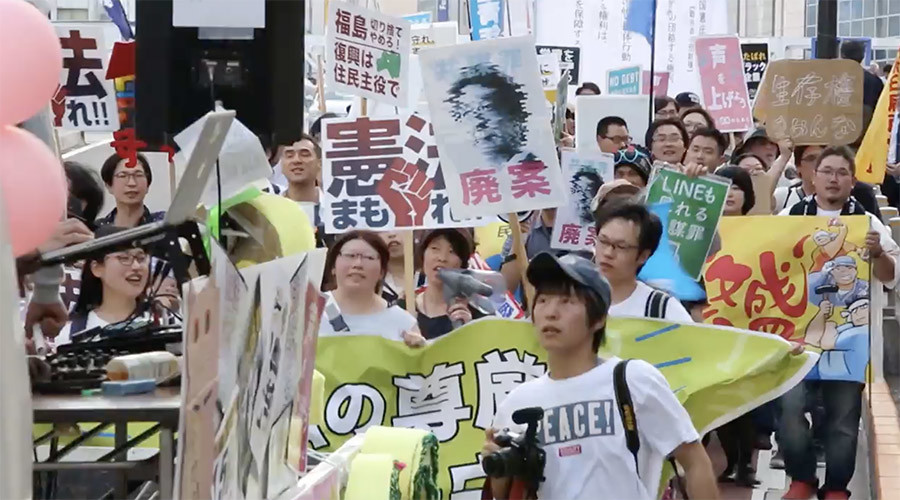100s of students march in Tokyo against Japanese PM Abe’s plans to change pacifist constitution