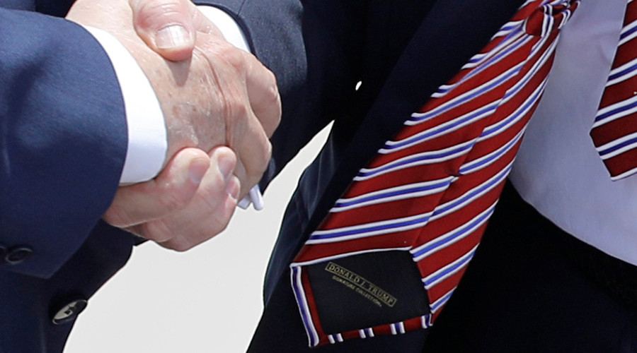 Trump gets beaten at his own never-ending handshake game