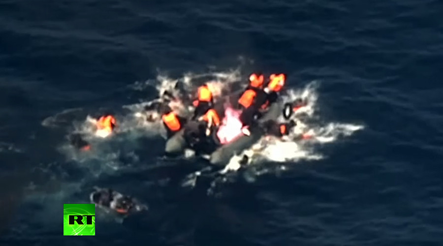 Horrifying moment migrant boat bursts into flames in the Med (VIDEO)