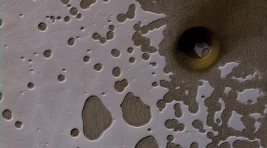 Solar pit or impact crater? NASA can’t decide